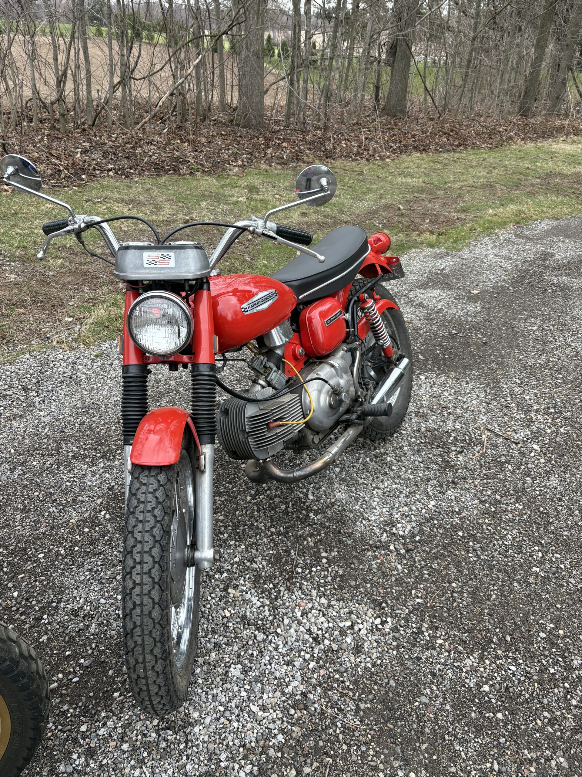 Motorcyclist riding safely on Canadian road during Motorcycle Safety Awareness Month in May