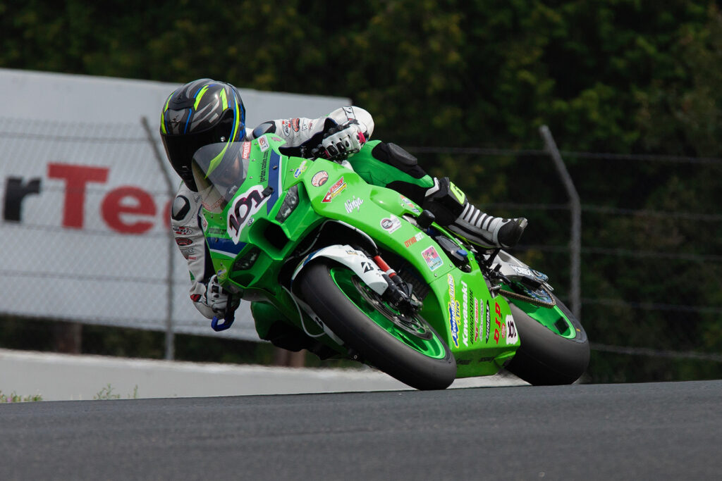 Motorcycle and car motorsports event in Canada with riders and track day participants